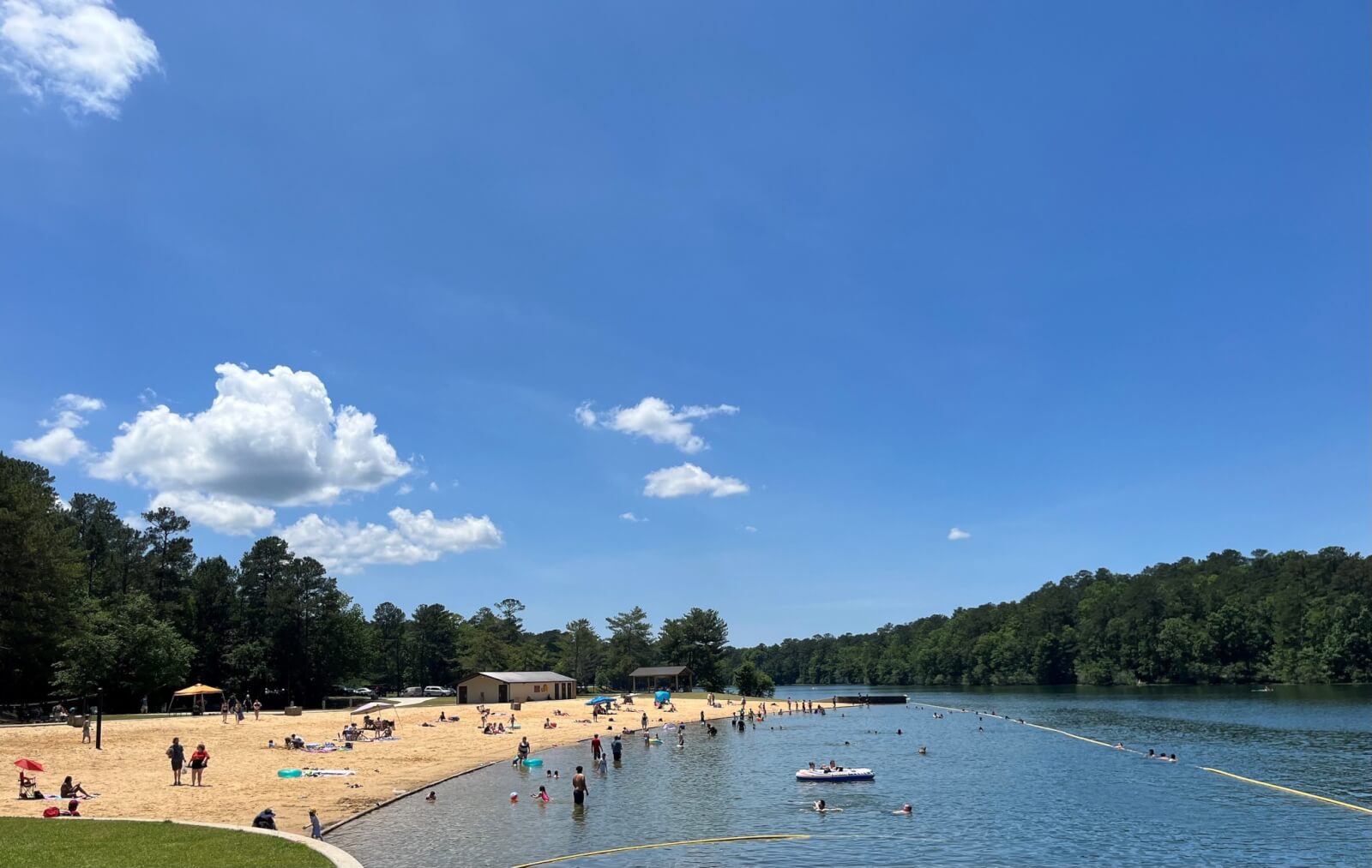 People enjoying the beach at Oak Mountain State Park