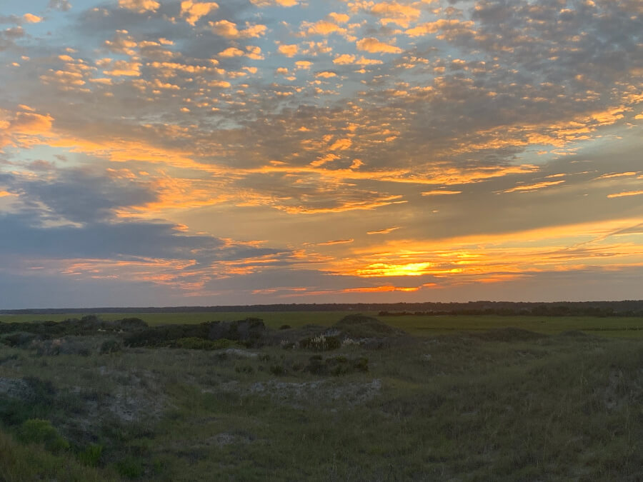 Sun setting over marsh in Brunswick Islands, NC