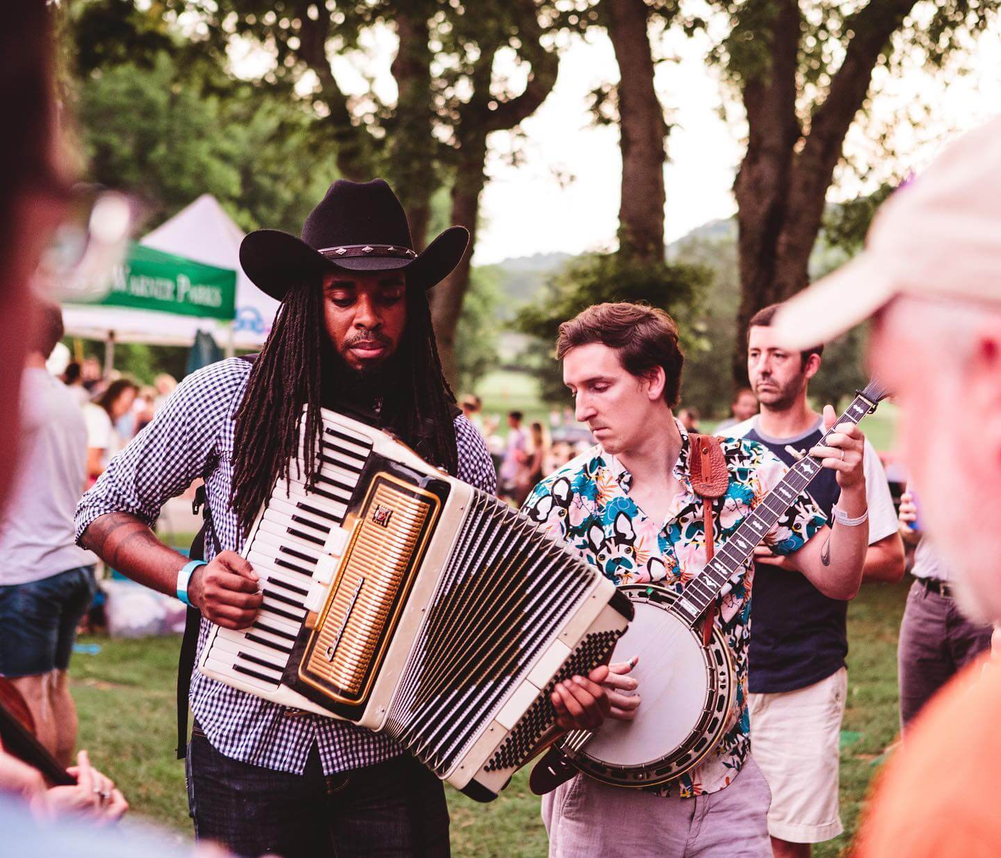 one musician playing accordion and one playing banjo
