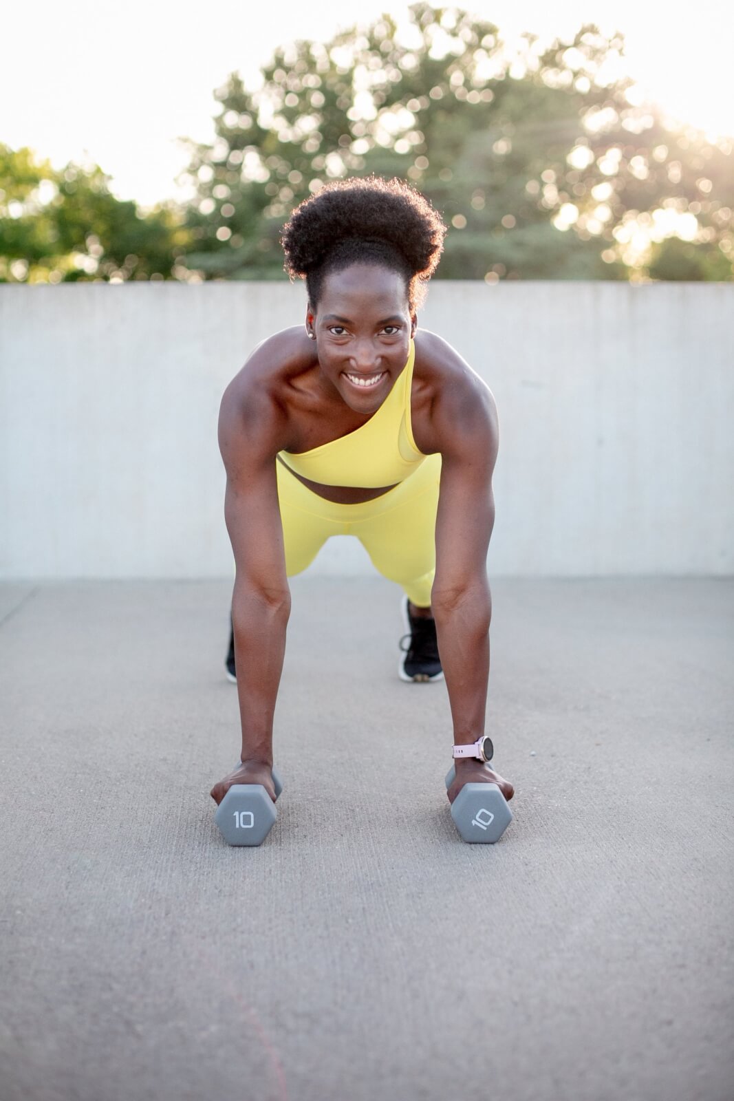 female fitness instructor with weights