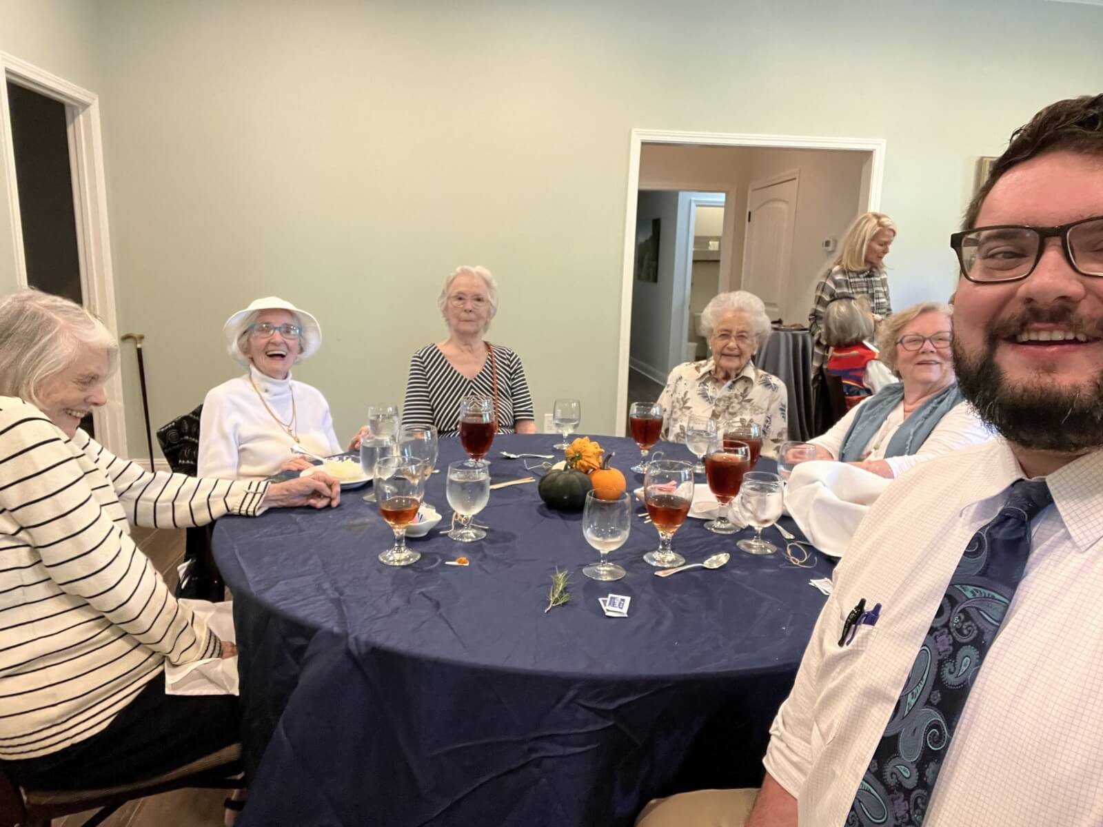 Ross Rochford sitting at lunch table with female residents of The Saint Paul.