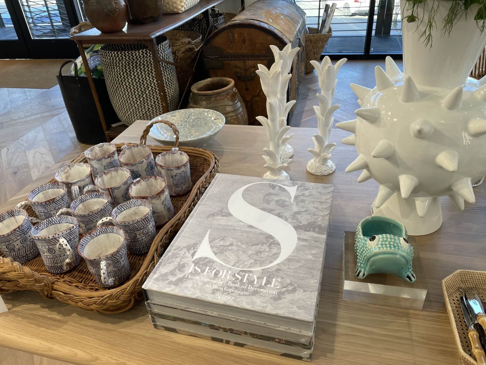Books, cups, and various trinkets at Schumacher.