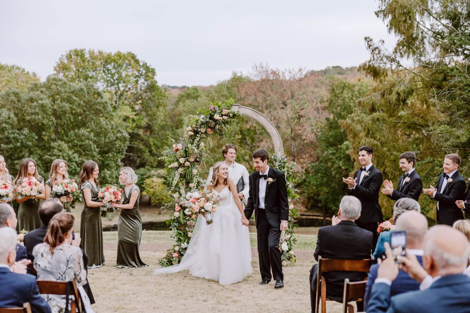 Blythe and Harrison leave their wedding ceremony as husband and wife.