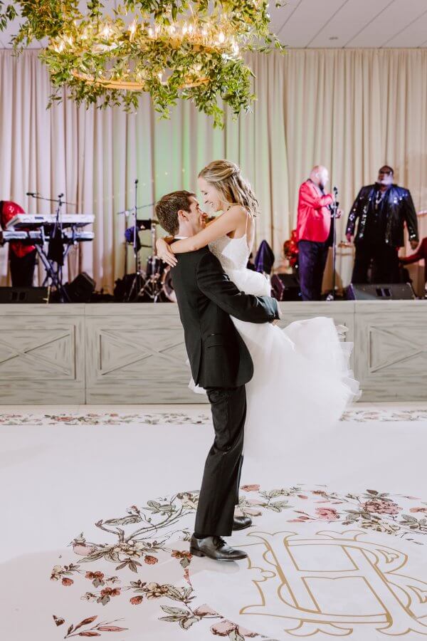 The bride and groom share a first dance.