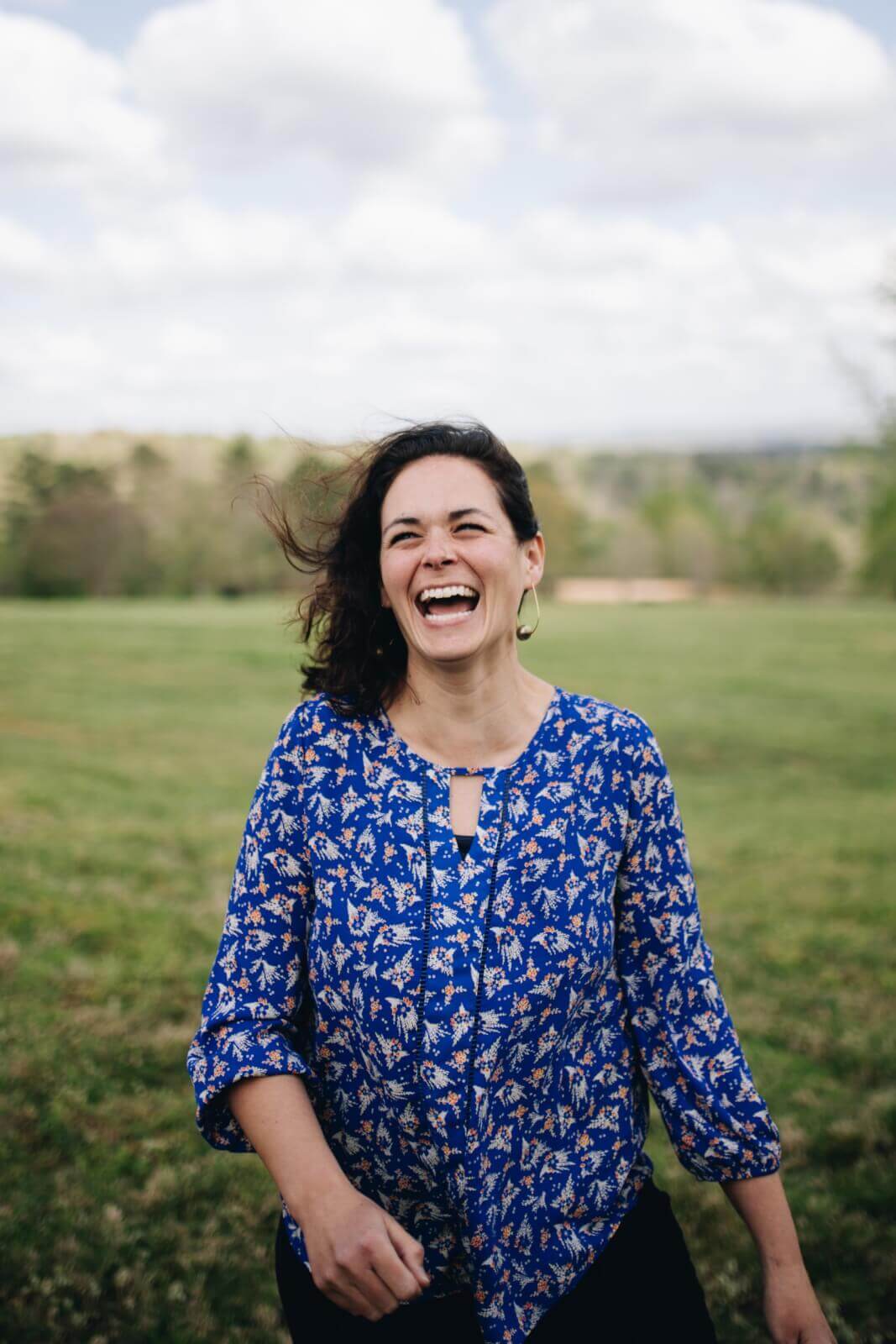 Betsy Hayes laughing in a field