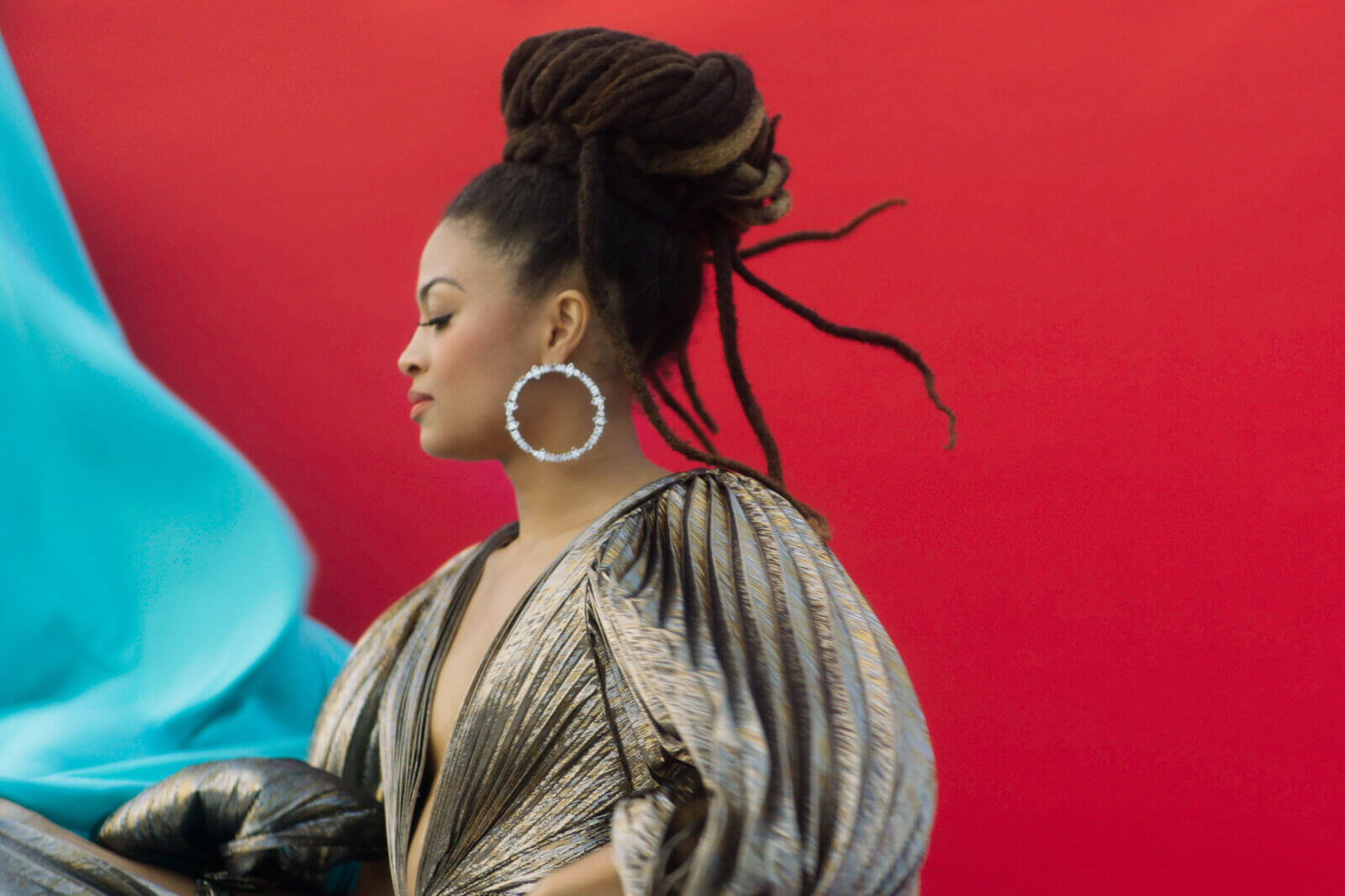 Photo of Valerie June in front of red wall