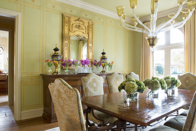 traditional dining room with ornate yellow walls