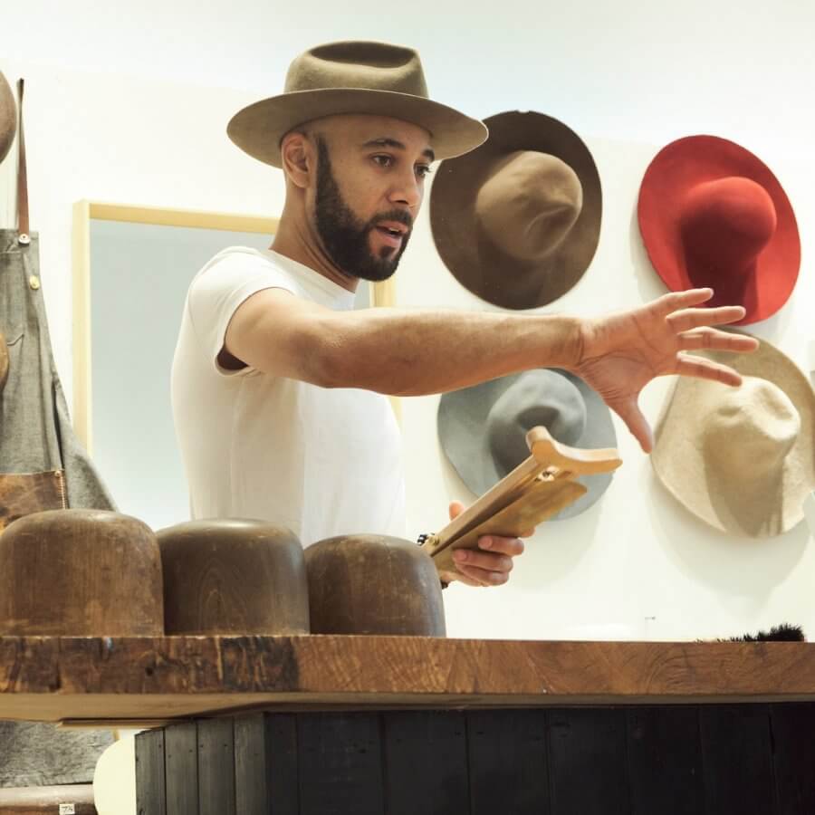 BM franklin hat maker giving a hat-making demo at the Atlanta store