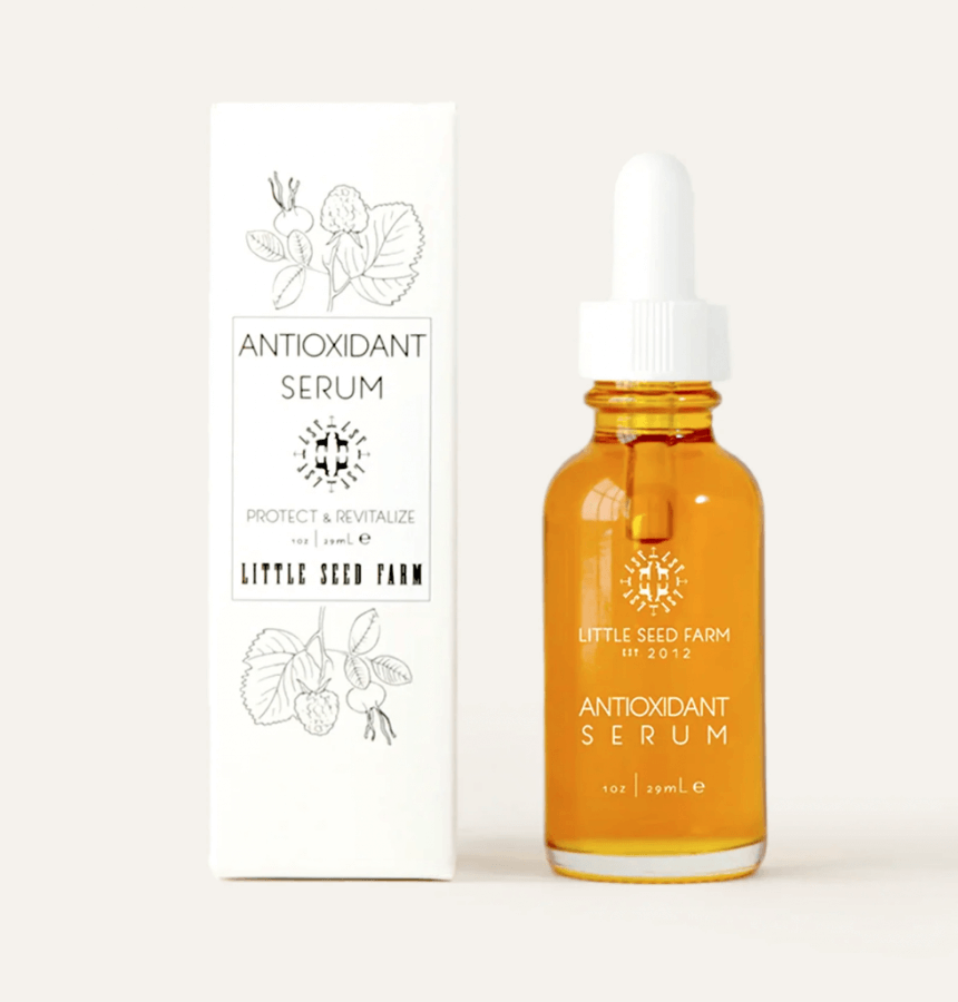 A glass dropper bottle of antioxidant serum next to its packaging, both labeled antioxidant serum 