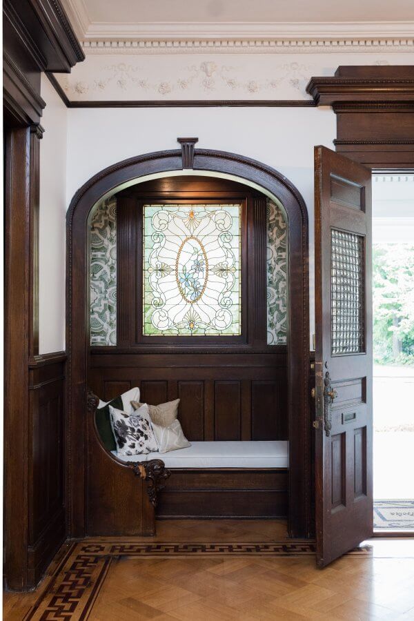 Built-in reading nook with stained glass window