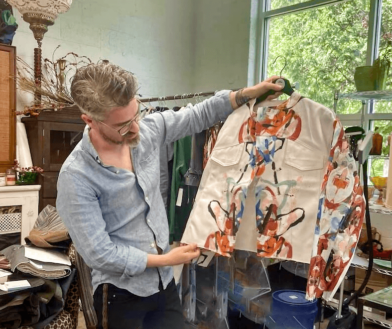 Stephen Curd with a jacket from his current collection