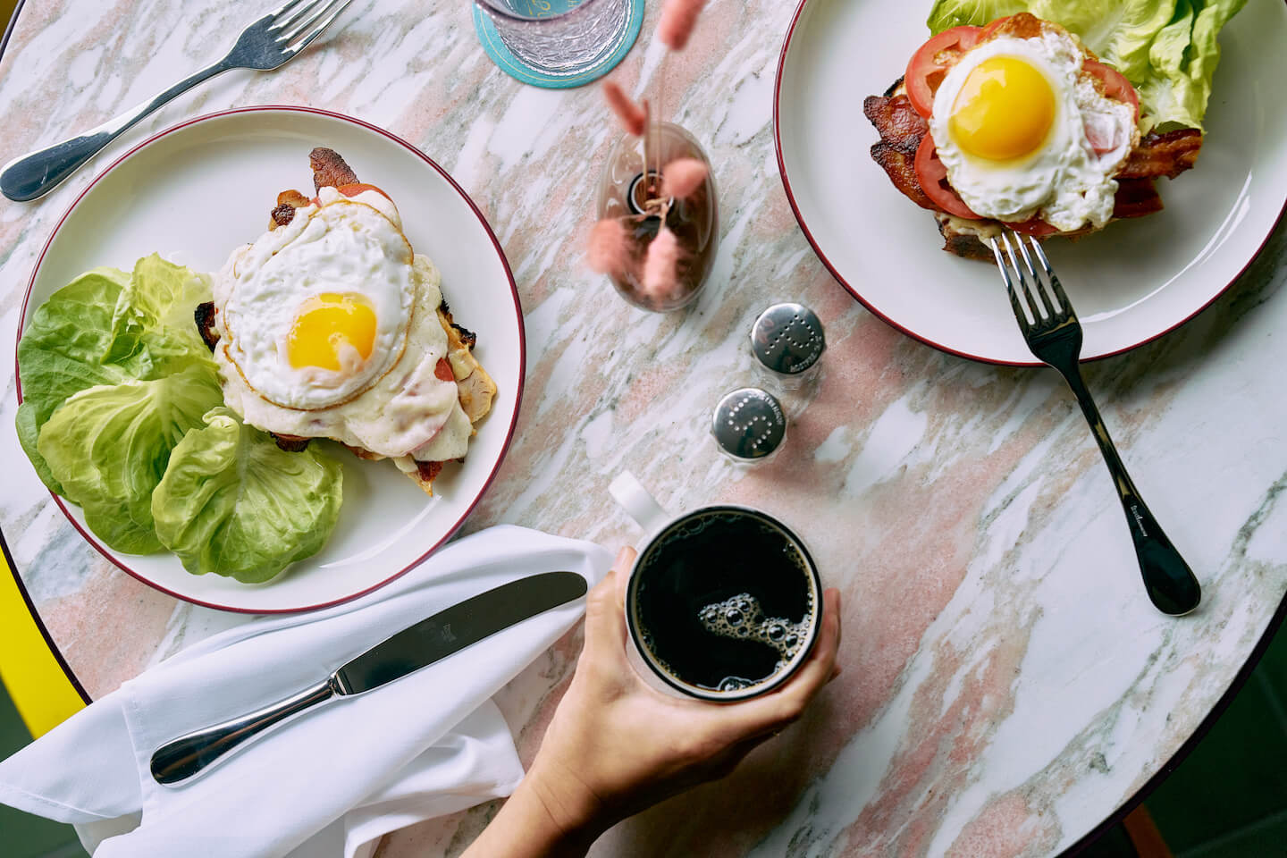 Table with various breakfast dishes and drinks.