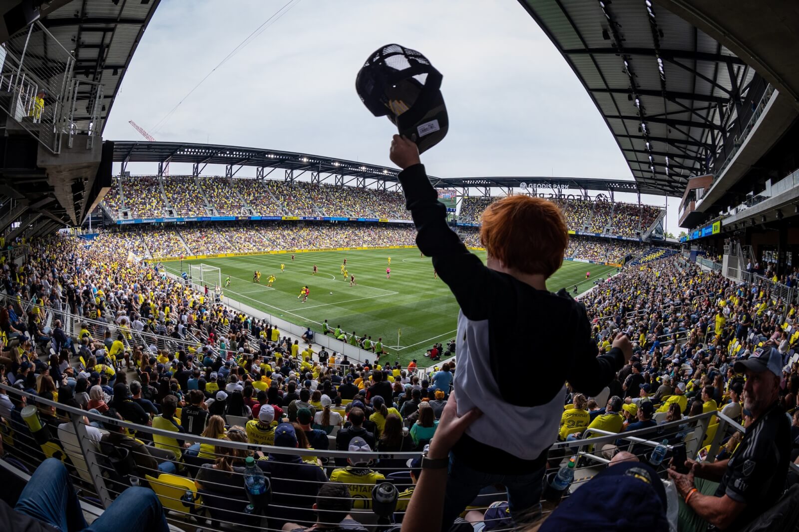 little boy at soccer stadium