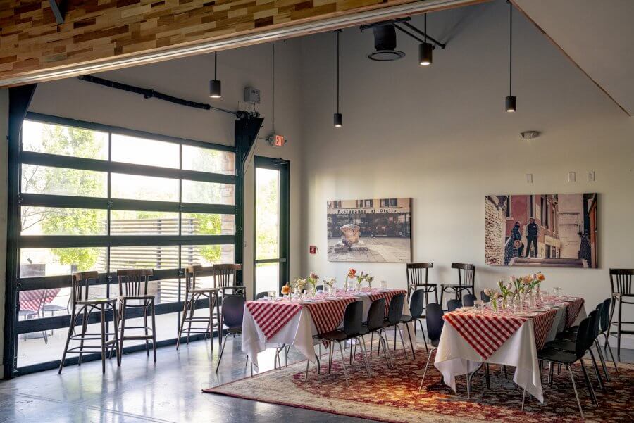 Pastaria's bright group space decorated for an event.