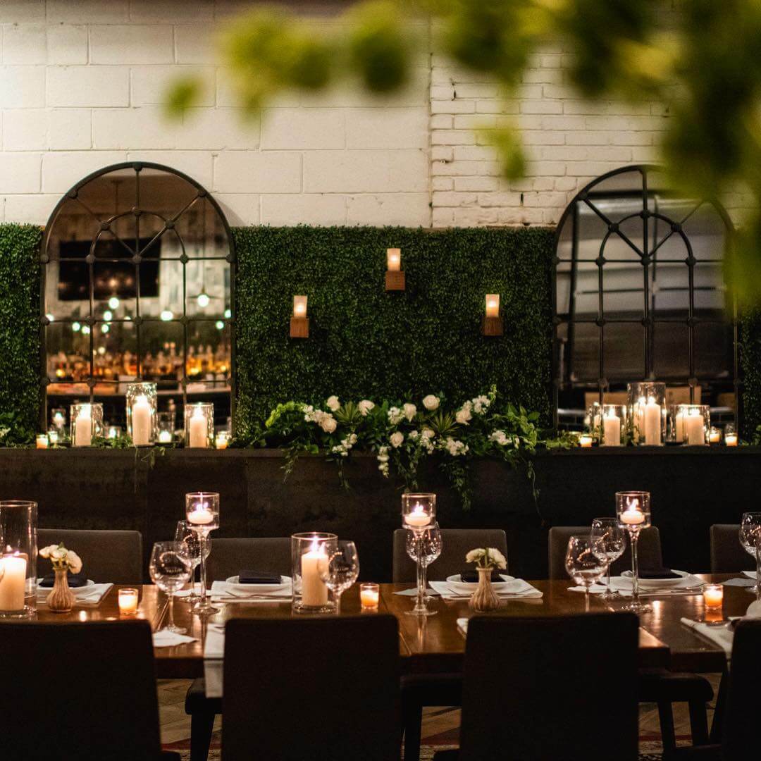 private dining room with candles and ivy