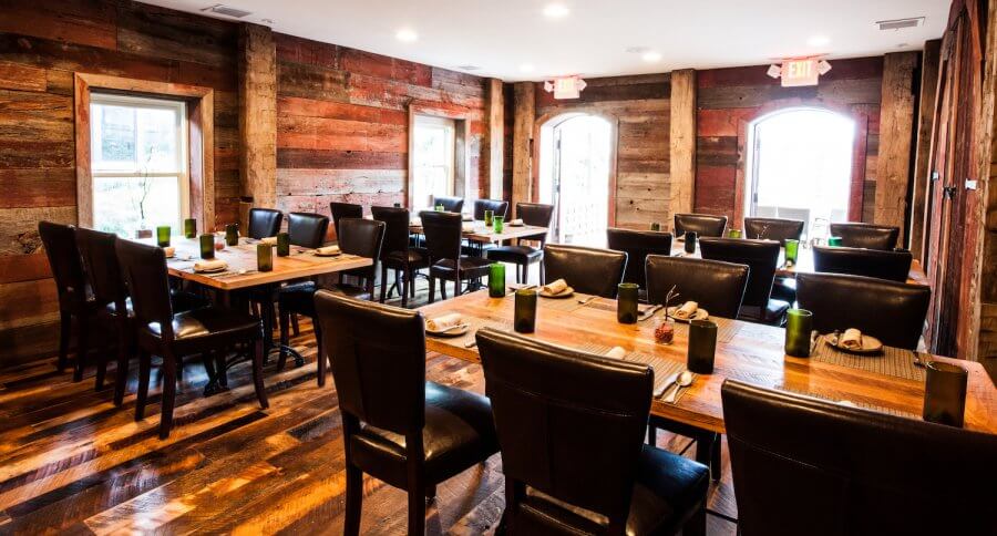 The Stables at Husk is a wood-covered private dining space. 