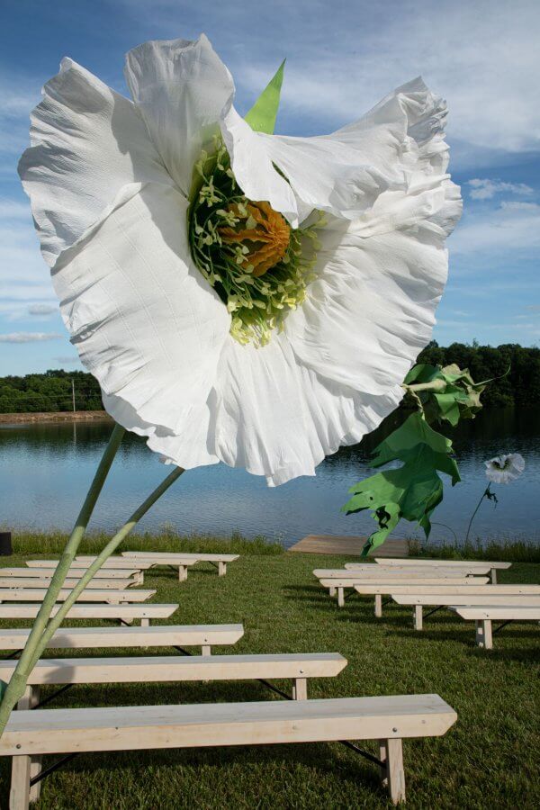 A Wild Storybook Wedding You Won't Believe - 14 Giant flower and ceremony seating on lake