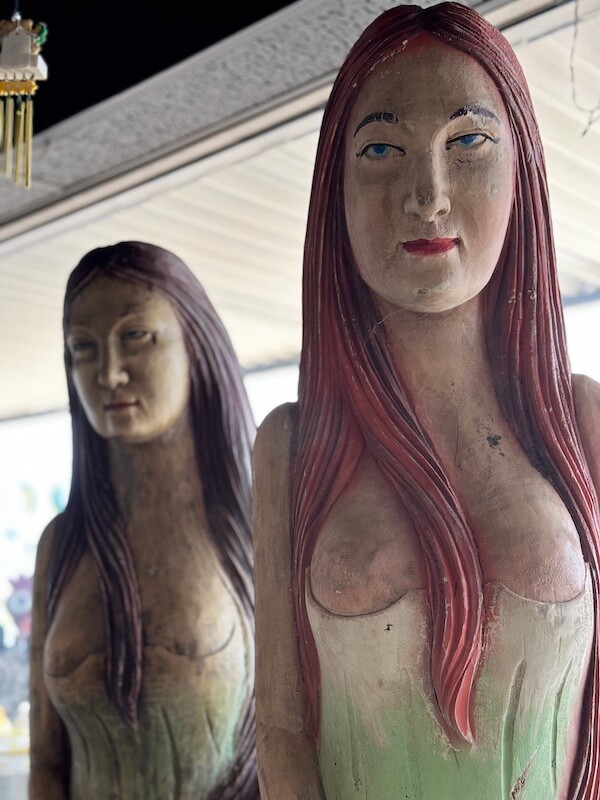 Two wooden statues of women