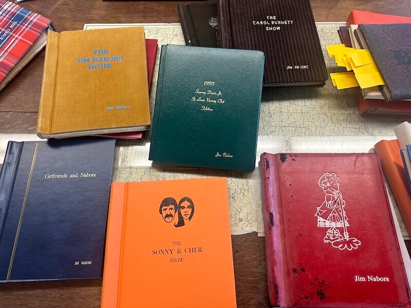 Script books of various colors on a table
