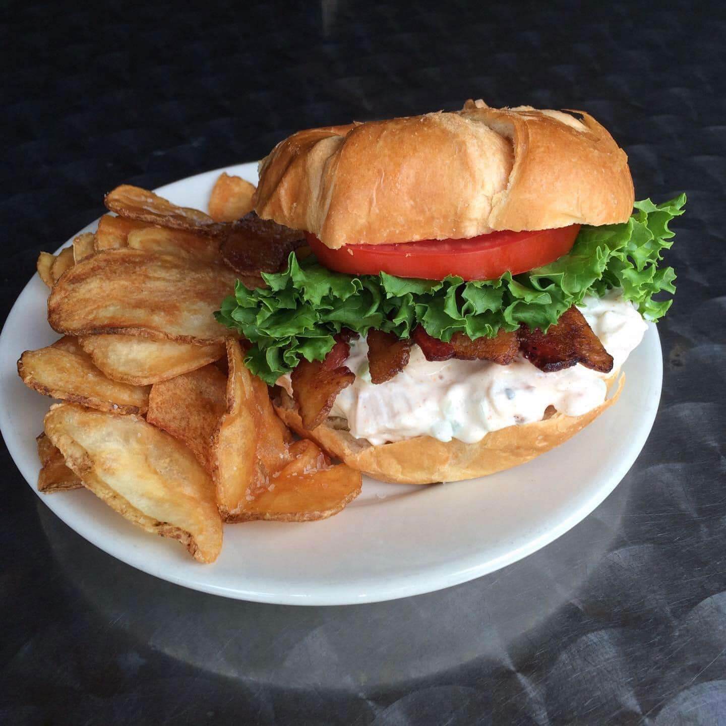 burger and chips on a white plate