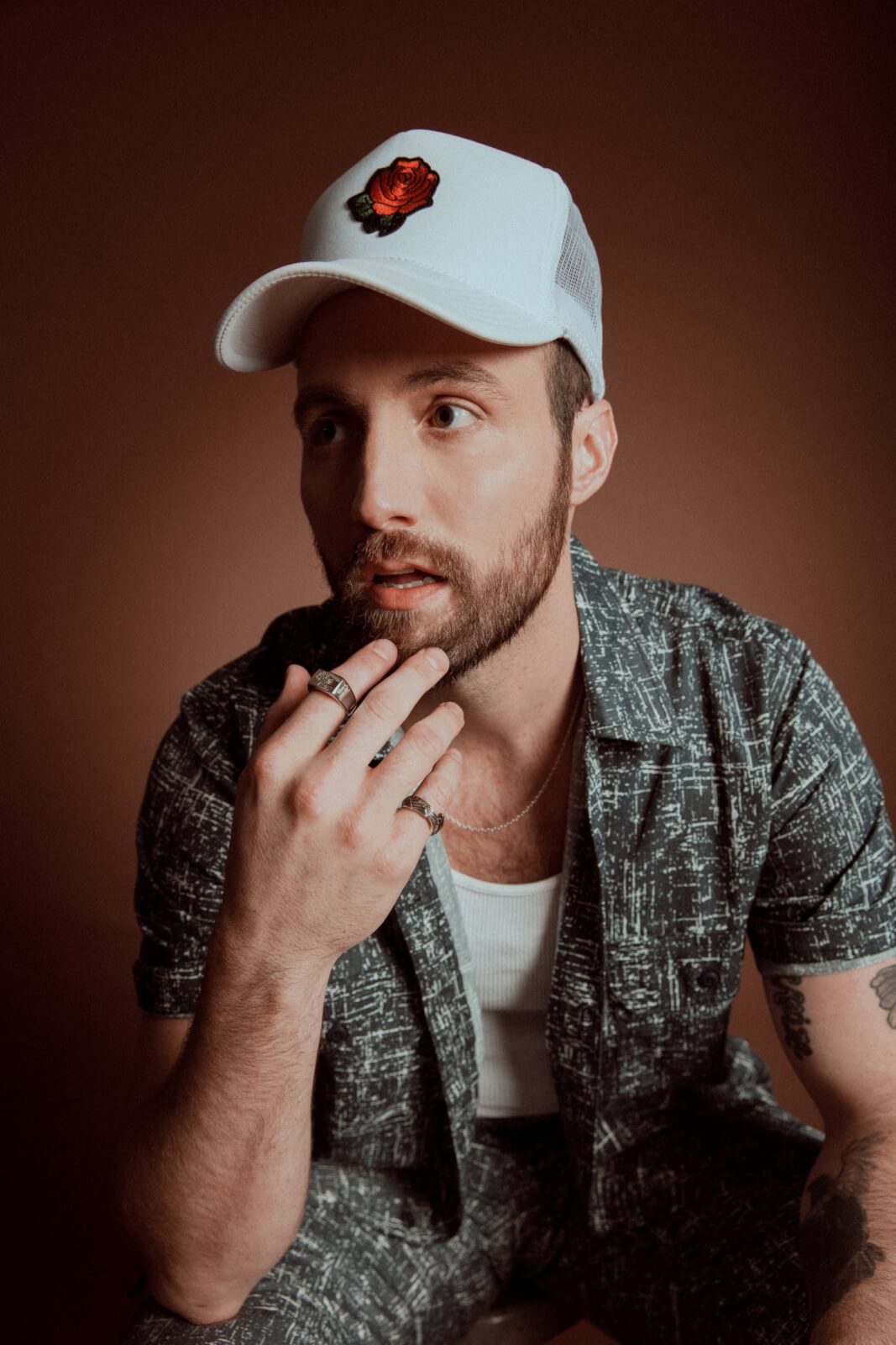 Ruston Kelly posing, touching beard.