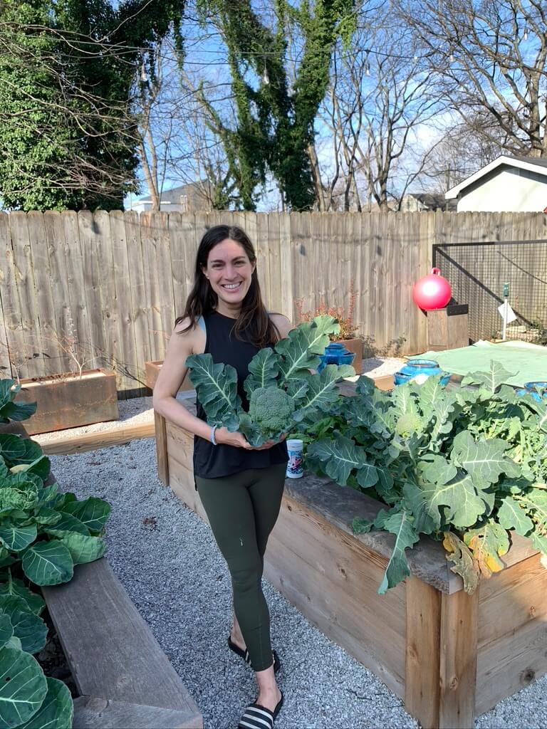Woman holding greens from her garden