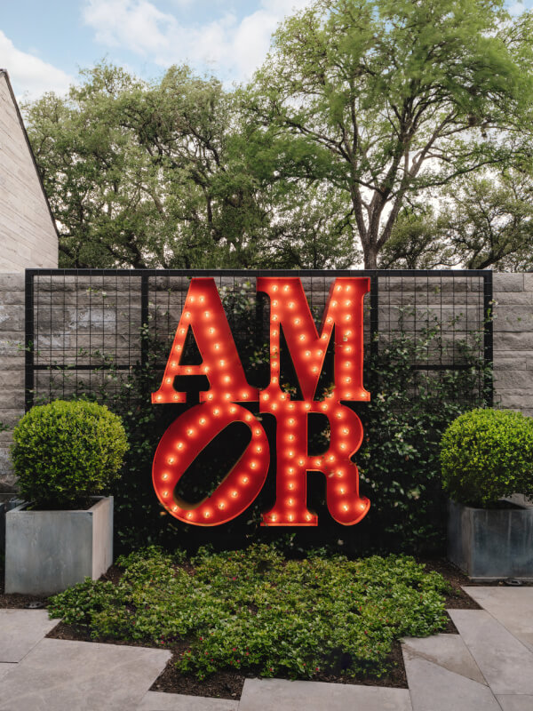 Backyard sign that says "AMOR"