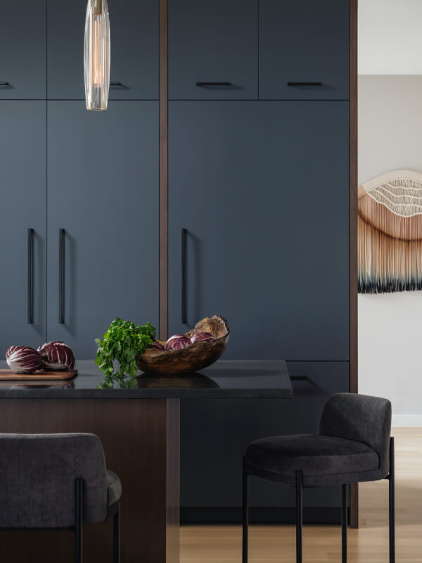 Close-up of island with blue cabinets
