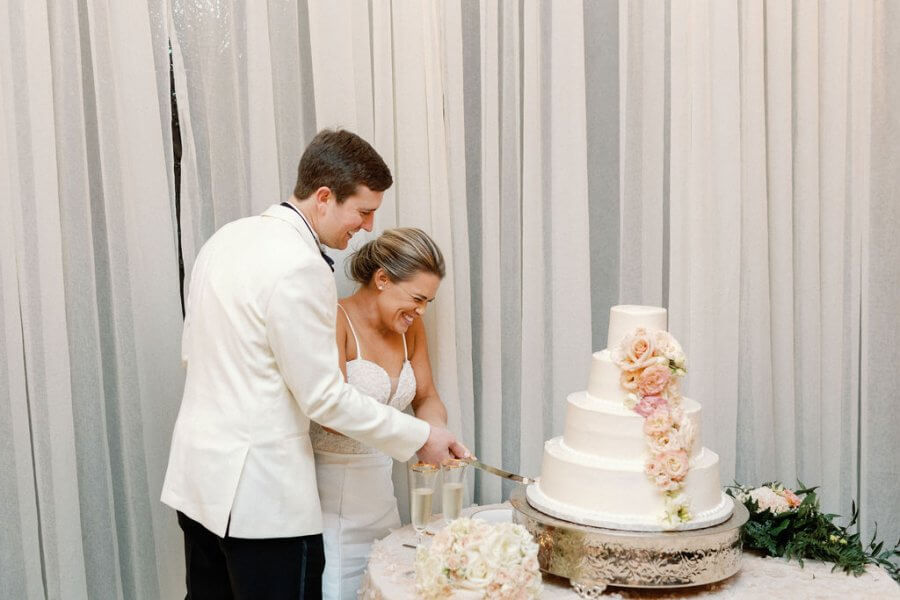 bride and groom cutting a wedding cake 