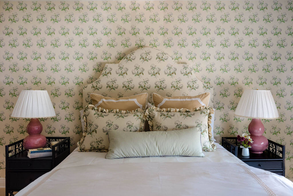 Guest bedroom with matching wallpaper and headboard, close-up of bed