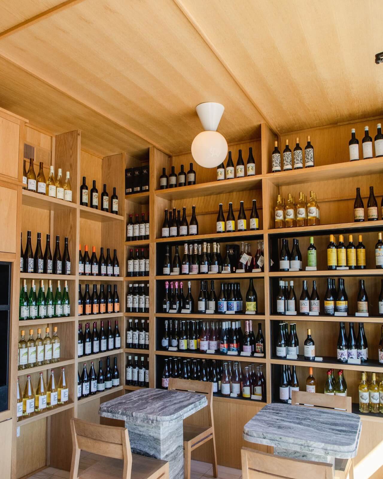 Wine bottles line the corner of Buka's chic, intimate dining area. 