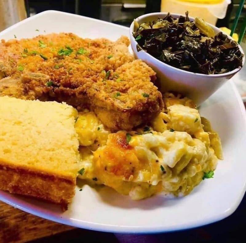 Pork chop, green, mac and cheese, and bread