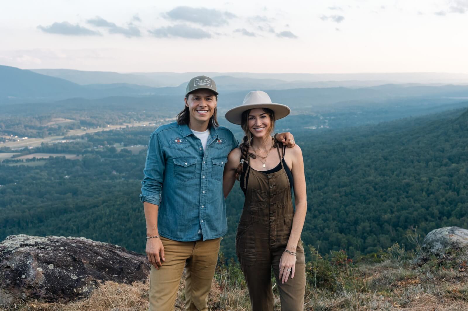 Seth and Tori Bolt posing on a mountaintop.