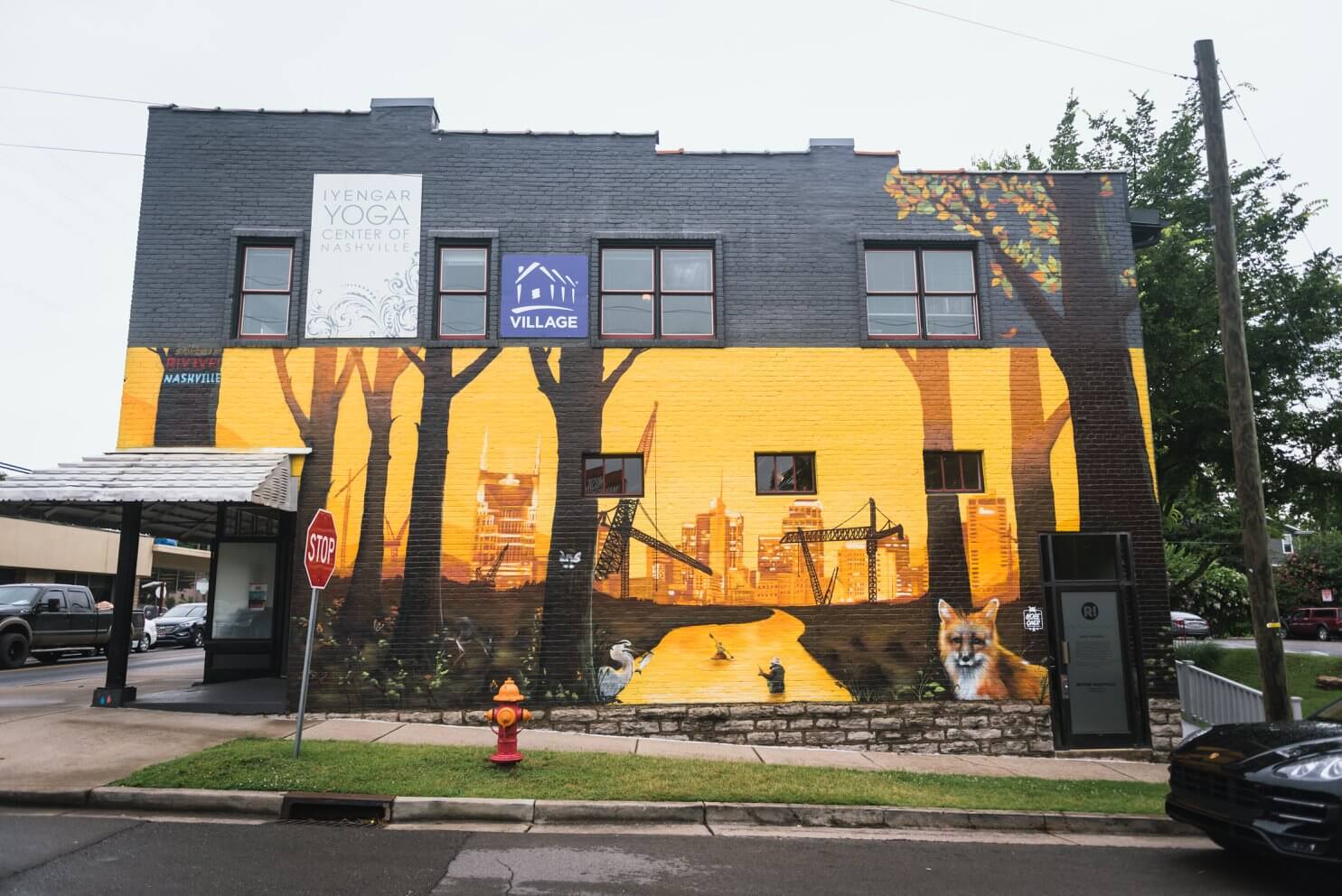 Yellow mural with trees, a fox, and downtown Nashville skyline