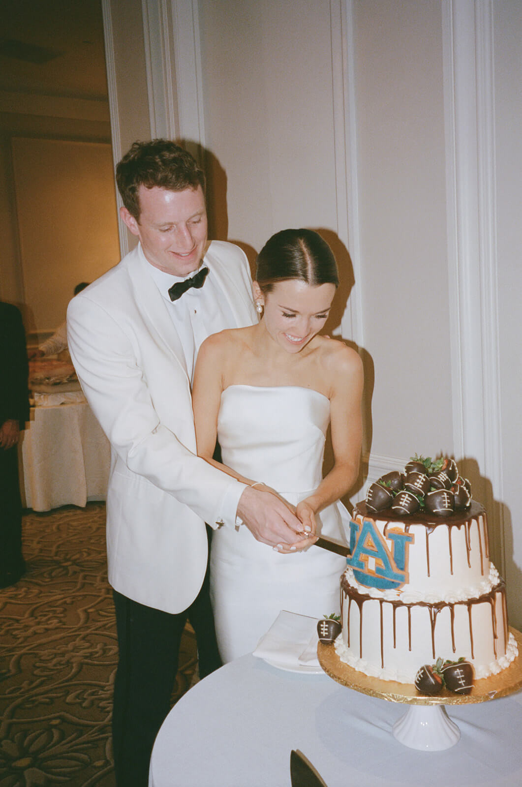 bride and groom cutting cake