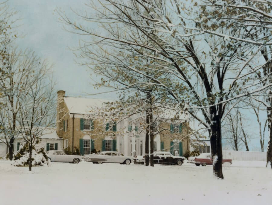 A winter scene of snow and care parks at Graceland in 1957