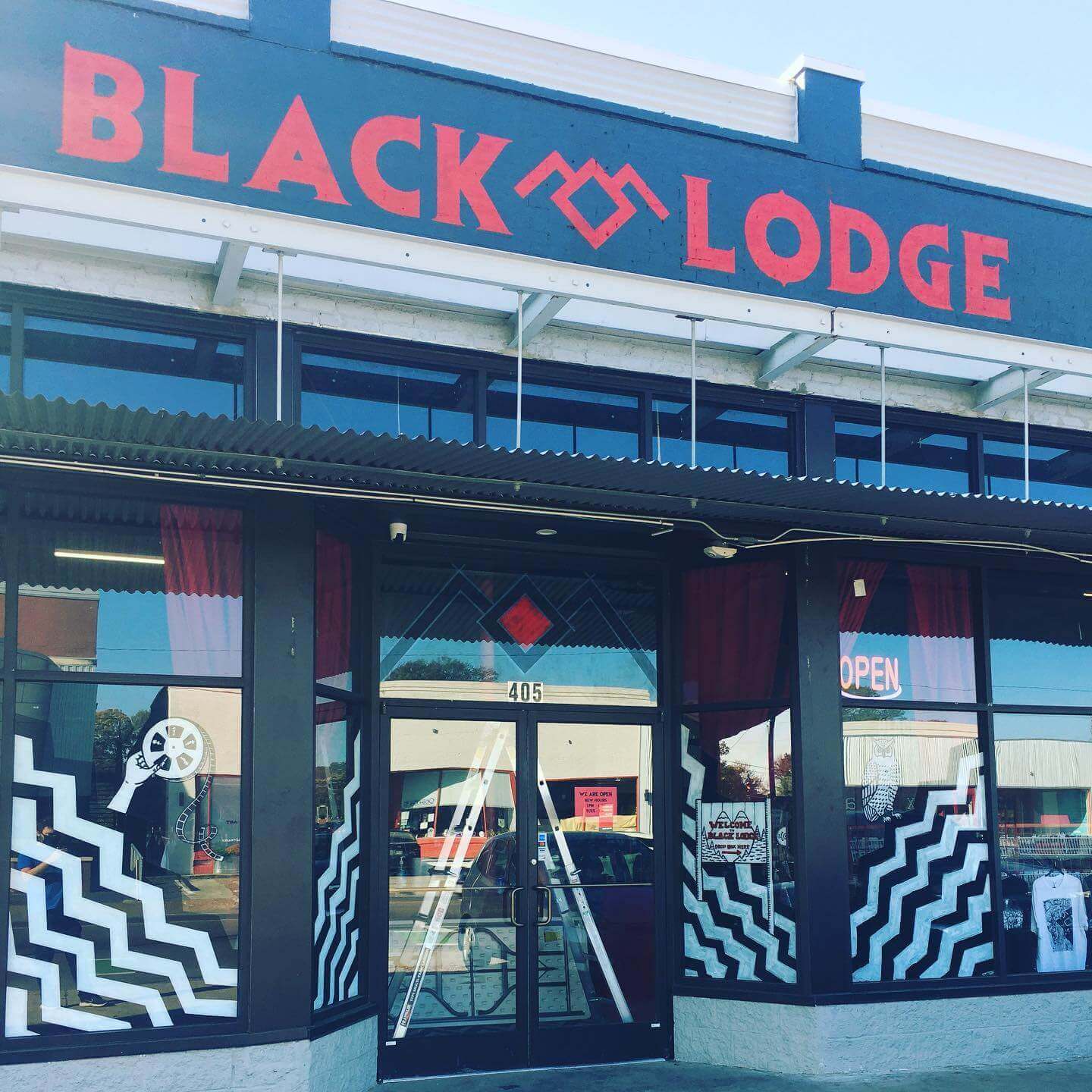 exterior of black lodge movie rental shop