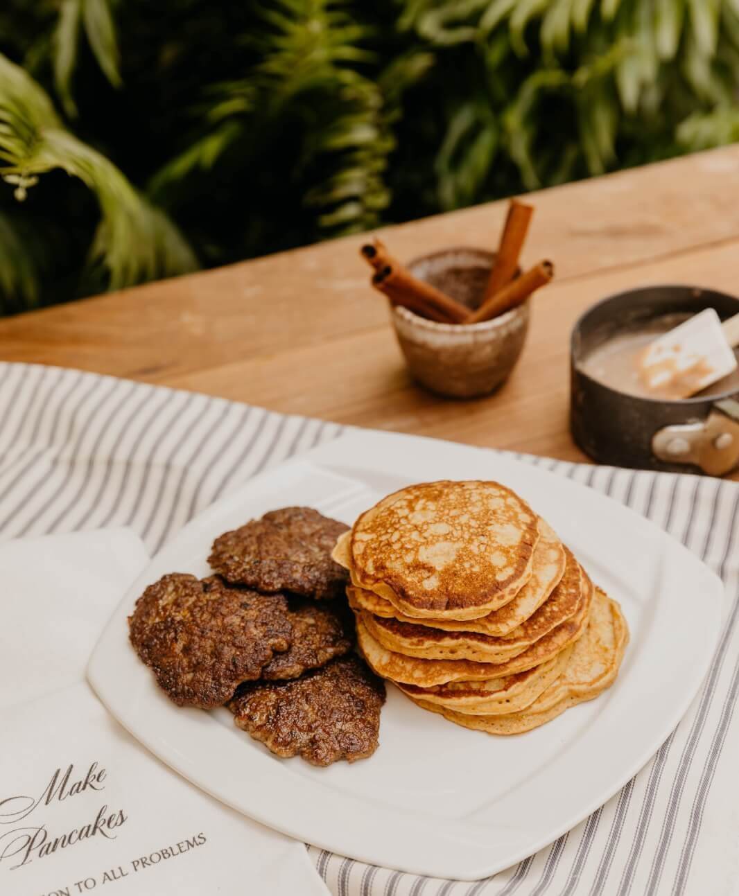 plated pancakes and sausage