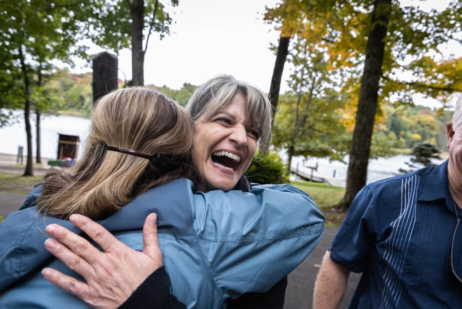 Woman hugging another woman