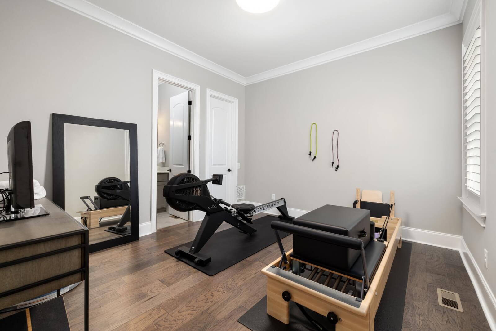 gym area with desk and mirror
