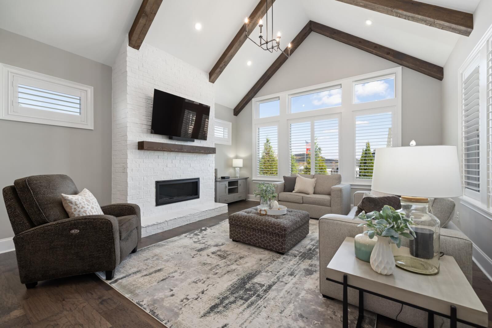 living room with vaulted ceiling and fireplace