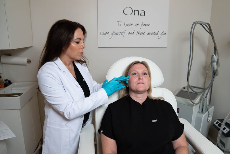 woman giving injections to another woman