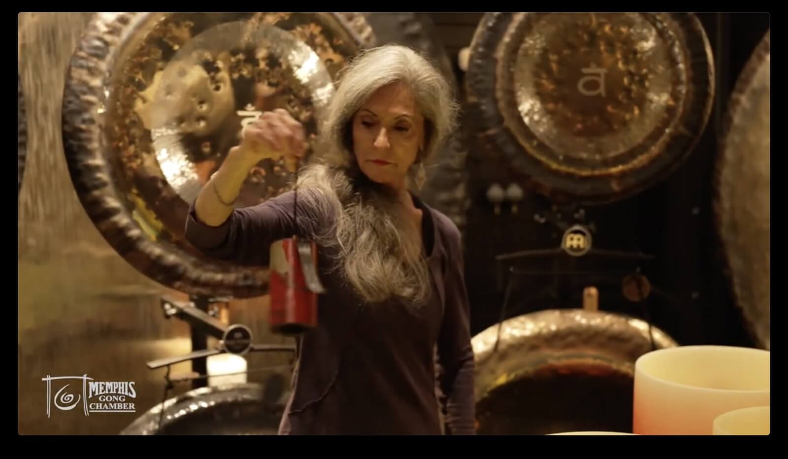 Woman in gong chamber