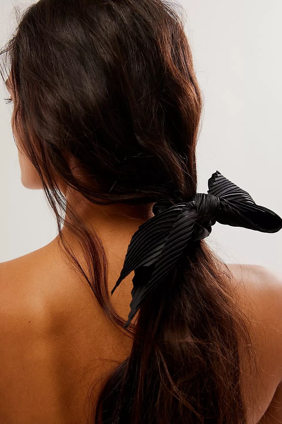 back view of model wearing bow scrunchie