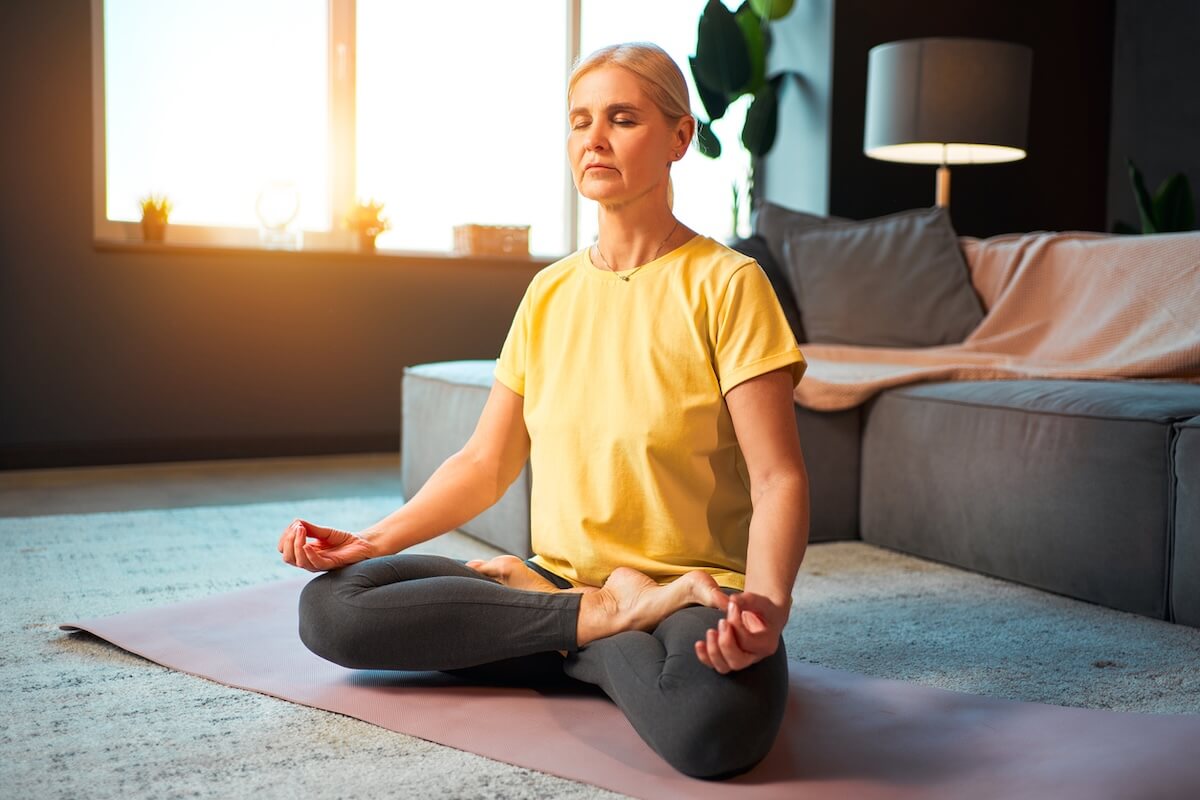 older woman doing yoga iStock 1484844103