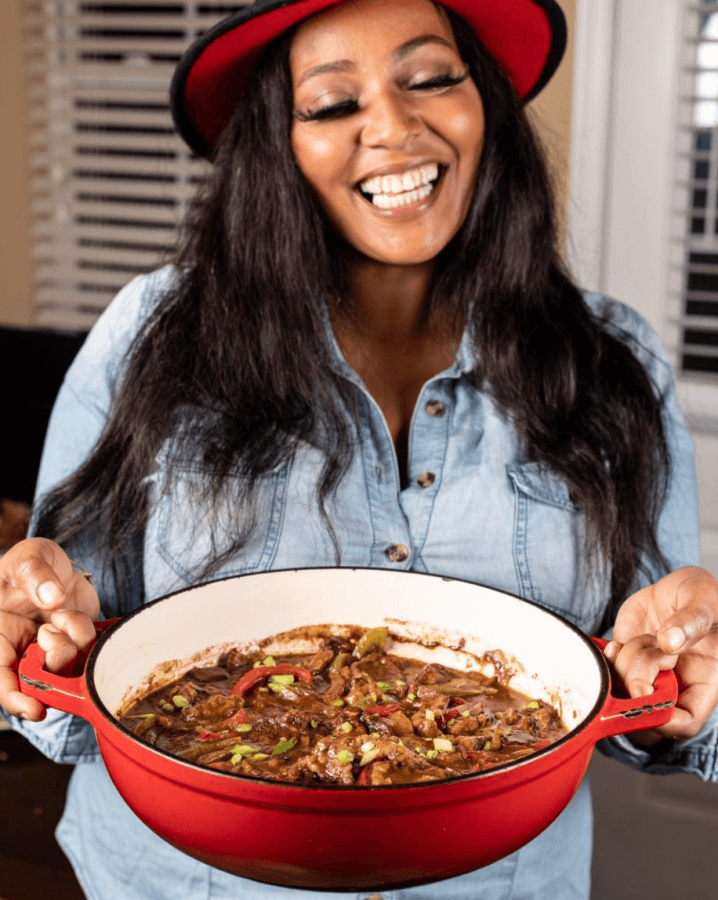 Chef Joya holdinig a stew