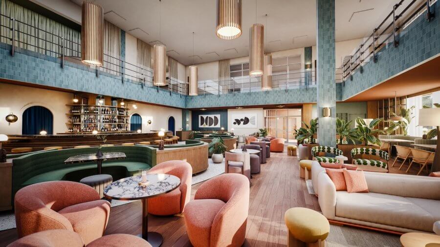 23 New Boutique Hotels in the South - 15 Spacious modern lounge in one of the city's new boutique hotels, featuring colorful furniture, marble tables, and a central bar. The high ceiling with large green and blue tiles, pendant lights, and indoor plants enhance the ambiance perfectly.