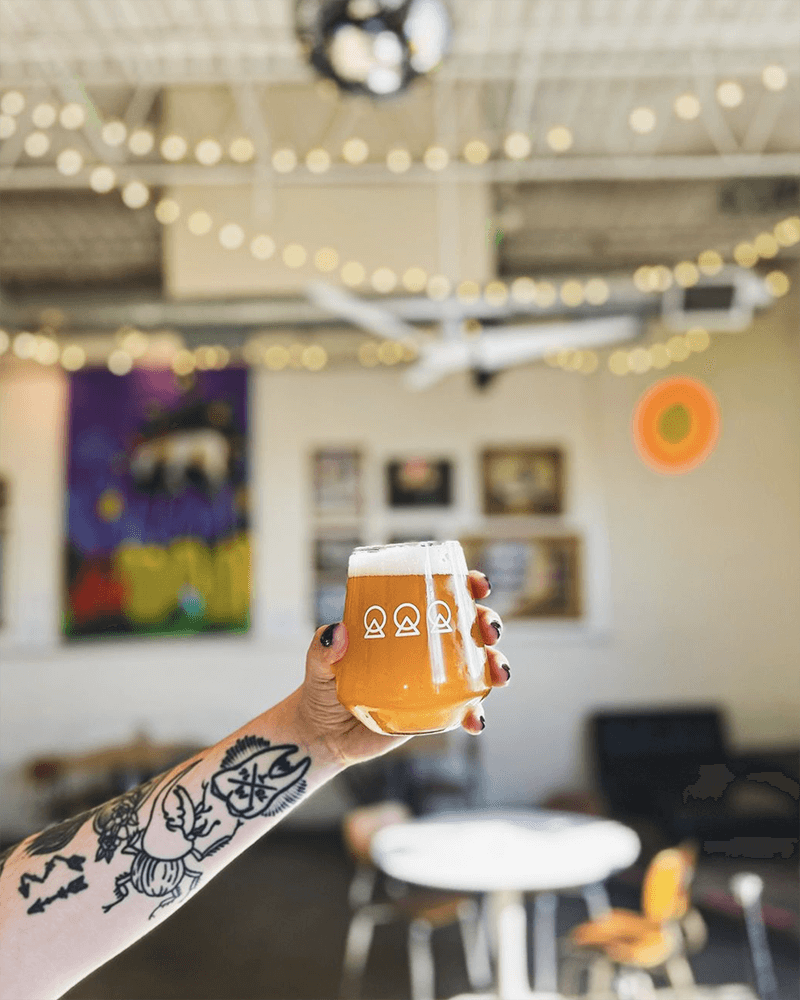 someone holding a beer