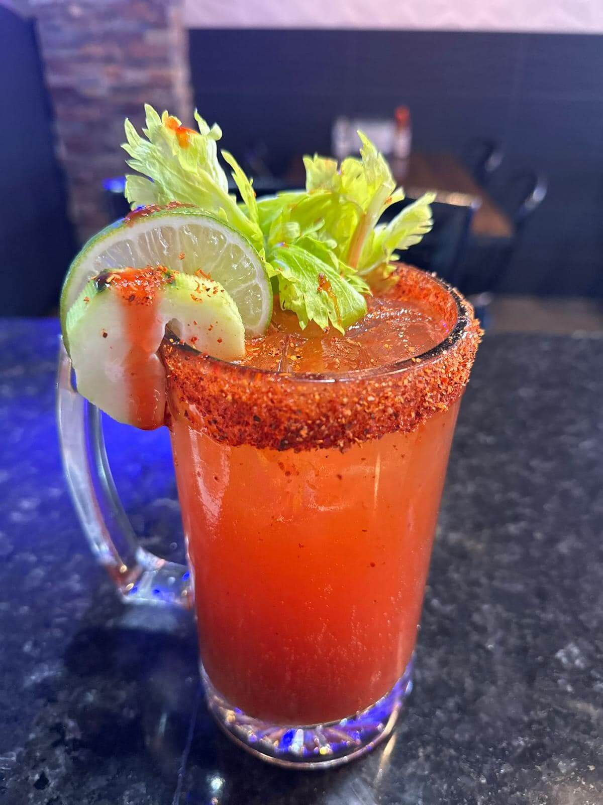 A bloody mary with a lime garnish.
