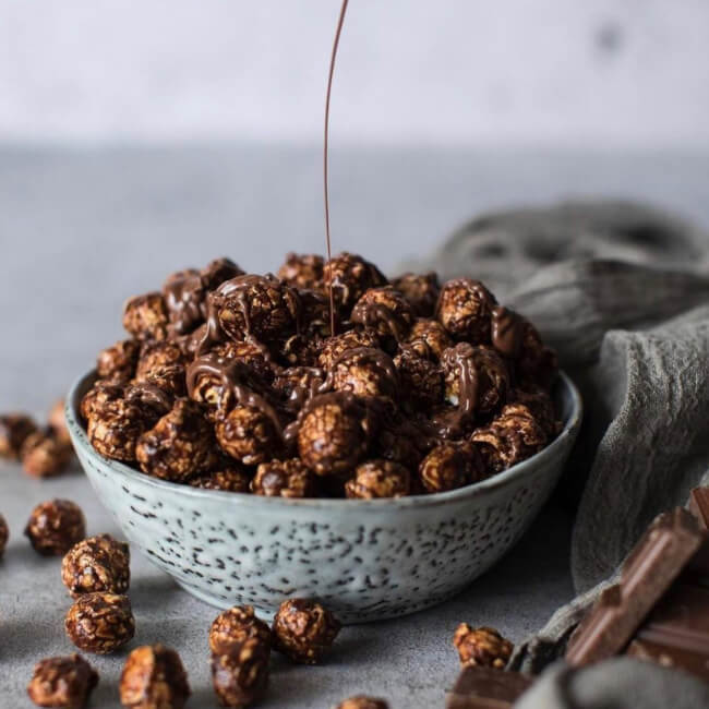 Bowl of popcorn drizzled with chocolate